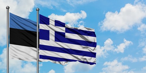 Estonia and Greece flag waving in the wind against white cloudy blue sky together. Diplomacy concept, international relations.