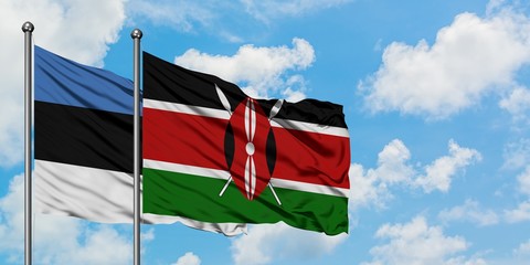 Estonia and Kenya flag waving in the wind against white cloudy blue sky together. Diplomacy concept, international relations.