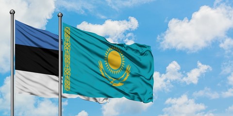 Estonia and Kazakhstan flag waving in the wind against white cloudy blue sky together. Diplomacy concept, international relations.