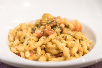 Busiate with pistachio pesto and shrimps served in a restaurant in Sicily, Italy