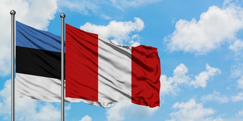 Estonia and Peru flag waving in the wind against white cloudy blue sky together. Diplomacy concept, international relations.