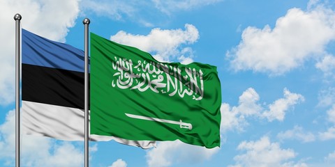 Estonia and Saudi Arabia flag waving in the wind against white cloudy blue sky together. Diplomacy concept, international relations.