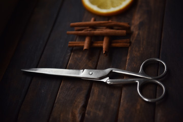 still life scissors sartorial orange slices and cinnamon sticks