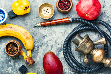 Oriental fruit smoking hookah.