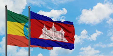 Ethiopia and Cambodia flag waving in the wind against white cloudy blue sky together. Diplomacy concept, international relations.