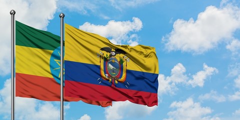 Ethiopia and Ecuador flag waving in the wind against white cloudy blue sky together. Diplomacy concept, international relations.