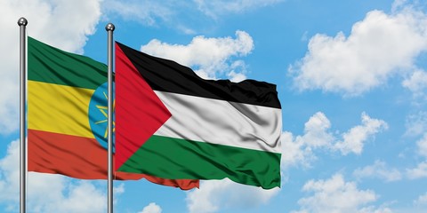 Ethiopia and Palestine flag waving in the wind against white cloudy blue sky together. Diplomacy concept, international relations.