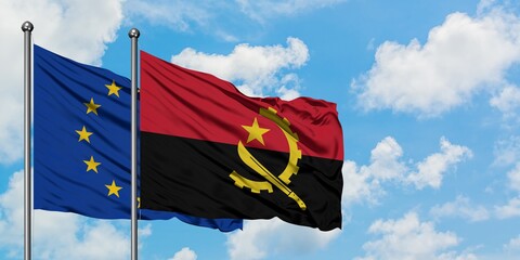 European Union and Angola flag waving in the wind against white cloudy blue sky together. Diplomacy concept, international relations.