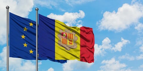 European Union and Andorra flag waving in the wind against white cloudy blue sky together. Diplomacy concept, international relations.