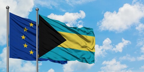 European Union and Bahamas flag waving in the wind against white cloudy blue sky together. Diplomacy concept, international relations.