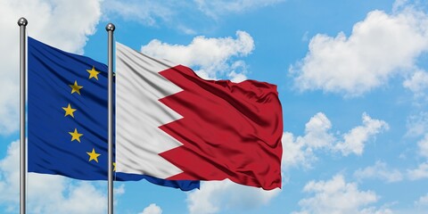 European Union and Bahrain flag waving in the wind against white cloudy blue sky together. Diplomacy concept, international relations.