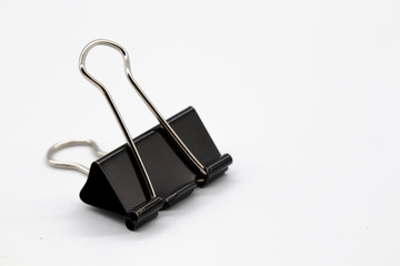black paper clip isolated on white background