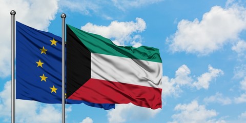 European Union and Kuwait flag waving in the wind against white cloudy blue sky together. Diplomacy concept, international relations.