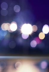 Empty abstract background. Reflection of blurry city lights on asphalt, smoke, bokeh. Neon...