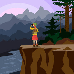 A young girl stands on a cliff and photographs a mountain landscape. Mountain landscape and river.