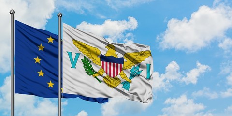 European Union and United States Virgin Islands flag waving in the wind against white cloudy blue sky together. Diplomacy concept, international relations.