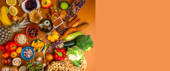 Banner of mixed colorful foods, and pills, contains antioxidants, vitamins, fiber. Immune boosting products. Healthy clean concept. Superfoods