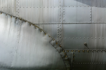 Aluminum sheet and rivet fastening. Aviation background.