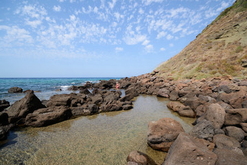 Fototapeta na wymiar rocks and Mediterranean sea in Cantareddi bay, near Castelsardo, in Sardinia Island 