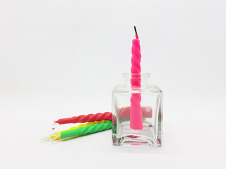 Various Colorful Twist Style Birthday Candle Green Red Pink Yellow in White Isolated Background