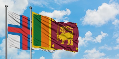 Faroe Islands and Sri Lanka flag waving in the wind against white cloudy blue sky together. Diplomacy concept, international relations.