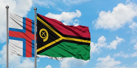 Faroe Islands and Vanuatu flag waving in the wind against white cloudy blue sky together. Diplomacy...