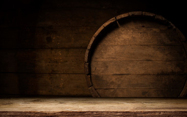 Old wooden barrel on a brown background