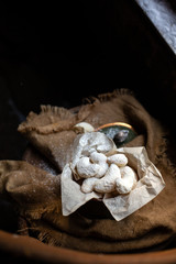 baked bagels cookies with powdered sugar on top in vintage christmas decorated metal box