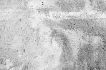 Texture of a concrete wall with cracks and scratches which can be used as a background