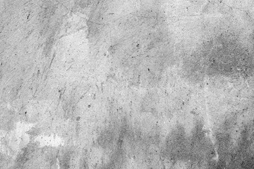 Texture of a concrete wall with cracks and scratches which can be used as a background