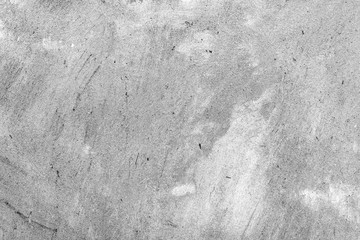 Texture of a concrete wall with cracks and scratches which can be used as a background