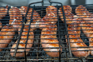 Closeup of sausage on the grill
