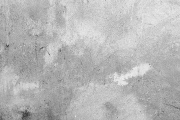 Texture of a concrete wall with cracks and scratches which can be used as a background