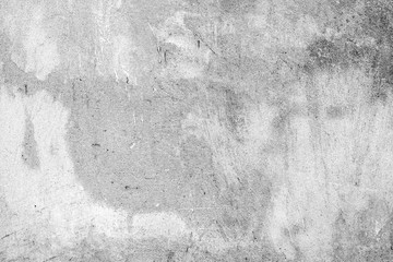 Texture of a concrete wall with cracks and scratches which can be used as a background