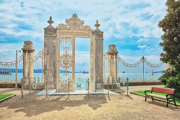 Beautiful white gate opening to Bosphorus in the park surrounding Dolmabahce palace in Istanbul, Turkey - 300851866