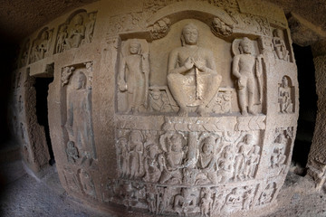 God budha hand made scriptures on walls in historic and centuries old kanheri caves in mumbai India