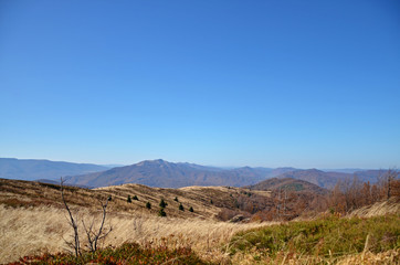 View of the peaks of low mountains in the fall