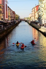 Milan, Italy, October 26, 2019 - Naviglio Grande: bohemian meeting place of the city full of nightlife due to the presence of many restaurants and street food, canoe passage