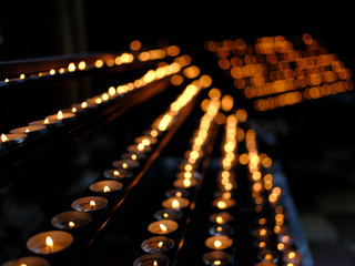 Many burning candles with shallow depth of field