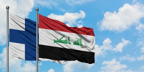 Finland and Iraq flag waving in the wind against white cloudy blue sky together. Diplomacy concept, international relations.