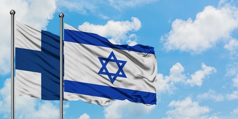 Finland and Israel flag waving in the wind against white cloudy blue sky together. Diplomacy concept, international relations.