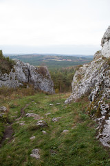 Vertical mountain landscape of limestone cliffs against a blue sky. The Zborow Massif in Central Poland on the Krakow-Czestochowa Upland