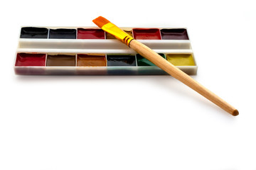 Soft painting brush with the set of paints isolated on white background