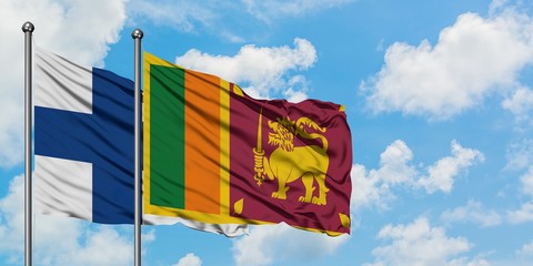 Finland and Sri Lanka flag waving in the wind against white cloudy blue sky together. Diplomacy concept, international relations.