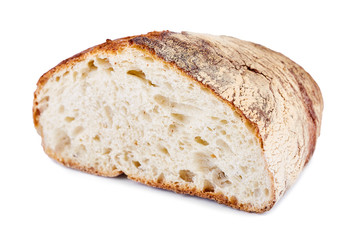 Cut homemade bread in three quarters isolated on white background