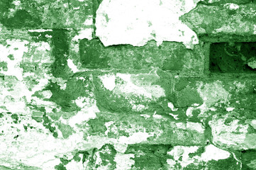 Old grungy brick wall texture in green tone.