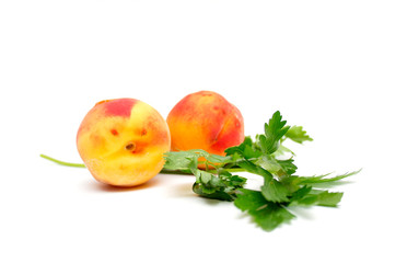 Peach with greens. Photo.