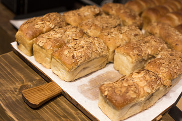 Loaf of bread with sliced almonds on top.