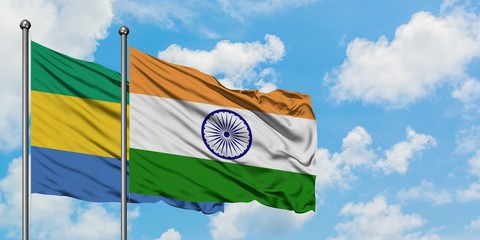 Gabon and India flag waving in the wind against white cloudy blue sky together. Diplomacy concept,...
