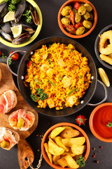 assortment of spanish food, tapas, mussel, paella